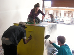 GRIND residents and community members paint the cube collaboratively.
